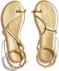 Chic Gold Ankle Wrap Sandals, Elegant Adjustable Ankle Tie Sandals, Chic Adjustable Toe Ring Leather Sandals, Adjustable Leather Toe Ring Sandals, Chic Adjustable Leather Toe Ring Sandals, Adjustable Leather Toe Ring Sandals In Chic Style, Adjustable Ankle Tie Sandals With Heel Strap, Adjustable Ankle Tie Leather Sandals, Elegant Gold Leather Lace-up Sandals