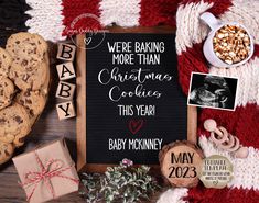 a baby announcement with cookies and other items