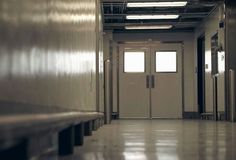 an empty hallway leading to two doors