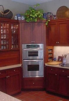 a kitchen with wooden cabinets and stainless steel appliances