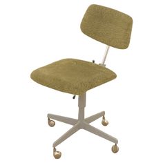 an office chair with wheels and a green seat pad on the back, in front of a white background