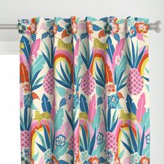 the curtains are colorful and decorated with tropical flowers, leaves, and birds on them