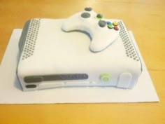 a cake shaped like a video game controller