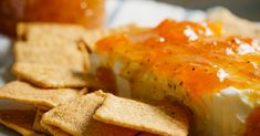 a close up of a plate of food with crackers