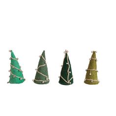 three small christmas trees in different colors