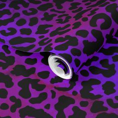 a purple and black animal print wallpaper with white circles on it's center