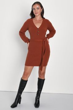 Get ready to romp through the leaves like a cutie in the Lulus Cozy Charmer Rust Brown Long Sleeve Mini Sweater Dress! Soft and stretchy ribbed sweater knit shapes this autumnal little dress with a V-neckline and a fitted bodice with a partial button placket, all framed by long sleeves. A tying detail at the waist punctuates the figure-hugging silhouette as it falls to a cute mini hem. Pair with your favorite boots for that perfect fall look! Fit: This garment fits true to size. Length: Mid-thig Brown Ribbed V-neck Dress, Fall Mini Knit Sweater Dress, Fall Knit Mini Sweater Dress, Brown Ribbed Sweater Dress For Spring, Spring Brown Ribbed Sweater Dress, Fall Ribbed Knit Sweater Dress, Brown V-neck Ribbed Dress, Winter Ribbed Brown Sweater Dress, Winter Brown Ribbed Sweater Dress