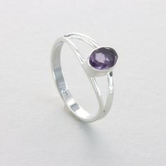 These is a beautiful Sterling Silver Ring with an Amethyst Gemstone from Brazil. The ring is made out of solid 925 Silver and there is no nickel or other substances causing most allergies. This makes the ring hypo allergenic. Size of the Amethyst 0.7 x 0.5 cm or  0.28 x 0.20 inch Please note: Our jewelry is photographed close up to show detail and may appear larger than they are. We use a dime coin as size reference on one of the pictures. You will receive the item in a gift box - perfect to surprise someone or yourself. Usually we ship on the same day we receive the payment for the order. We want you to be happy with your purchase. If you do not like what you bough can send it back and we will refund you the money. Please do not hesitate to contact us so we can solve any issue you might h Spiritual Amethyst Birthstone Ring In Sterling Silver, Spiritual Sterling Silver Amethyst Birthstone Ring, Silver Amethyst Gemstone Ring In Sterling Silver, Silver Amethyst Ring In Sterling Silver, Spiritual Sterling Silver Hallmarked Amethyst Ring, Spiritual Oval Amethyst Ring In Sterling Silver, Classic Sterling Silver Amethyst Ring With Polished Finish, Oval Amethyst Ring In Sterling Silver, Spiritual Style, Sterling Silver Amethyst Ring With Polished Finish As Gift