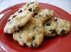 chocolate chip cookies are on a red plate