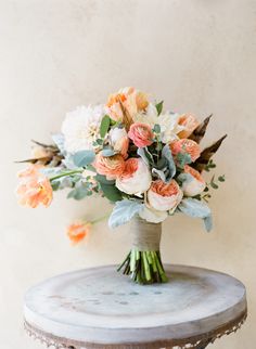 a bouquet of flowers sitting on top of a table