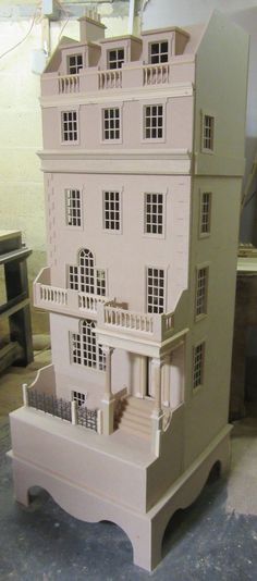 a large doll house sitting on top of a table