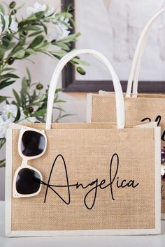 two bags with sunglasses on them are sitting next to each other and one has the word argefica written on it