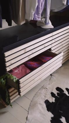 an ironing board sitting on top of a dresser