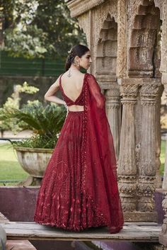 Red embroidered lehenga, choli, and dupatta set. This exquisite set features intricate embroidery that will make you feel like a masterpiece. It's the perfect ensemble for any special occasion, showcasing your refined taste and unique sense of style. You'll effortlessly stand out in any crowd, radiating elegance and sophistication. Color: Red FIT: Fitted at body and waist Fabric Composition: Net and Organza No. of pieces : 3 Delivery Time: 21 days Embroidery Geometric, Leaf Sleeve, Geometric Leaf, Net Embroidery, Types Of Work, Red Lehenga, Embroidered Lehenga, Embroidered Dupatta, Dupatta Set