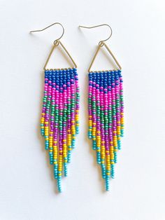 Beaded fringe earrings that are fun, vibrant, and can add a little "pop" of style to any outfit. Color:  multi color Made with size 11 Czech glass seed beads. Nymo beading thread Brass triangle frame. Earring hooks are made of solid brass. High quality, not easily deformed. Lead, Nickel, Cadmium Free and Hypoallergenic. Triangle Frame, Beaded Fringe Earrings, Beading Thread, Beaded Fringe, Glass Seed Beads, Seed Bead Earrings, Earring Hooks, Fringe Earrings, Bead Earrings