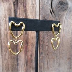 "90s gold tone modernist double heart dangle earrings. Stud backs. Light and comfy--one weighs more than a penny, less than a nickel.  They are 1-3/8\"  long x 11/16\" at widest part Nice and bright with no real flaws." Plain Outfits, Puffed Heart, Heart Dangle Earrings, Minimalist Gifts, A Penny, Double Heart, Earrings Stud, Heart Earrings, Statement Earrings