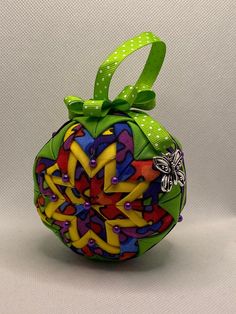 a colorful ornament with a bow on it