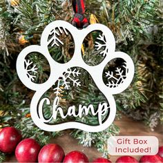 a christmas ornament with the word change on it and an image of a dog's paw