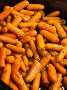 carrots are being cooked in a large pot