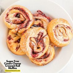 several cranberry crescent pastries on a white plate with the words sugar free crescents