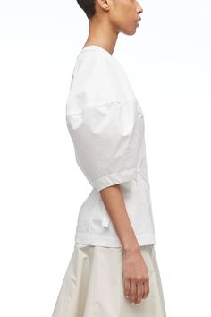 V-Neck Puff Sleeve Top – 3.1 Phillip Lim Modern Poplin Tops For Spring, Spring Poplin Tops With Relaxed Fit, Cotton Puff Sleeve V-neck Top For Work, Short Sleeve Poplin Blouse For Work, Poplin Short Sleeve Workwear Blouse, V-neck Cotton Puff Sleeve Top For Work, Summer Poplin Short Sleeve Tops, Cotton Blouse With Tie Sleeves And Relaxed Fit, White Cotton Top With Elastic Sleeves