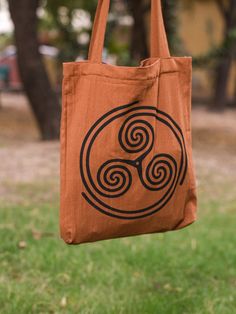 Product Type: Bag Materials: Cotton Dimensions: 14*16 Colors/Patterns: Brown FEATURES -  ♦Soft and Durable Cotton Fabric Spiral Tote Bag ♦Versatile Warm Brown Hue Artistic Spiral Print Tote ♦Chic Everyday Zip Closure Tribal Print Tote Bag ♦Fashionable Brown Cotton Spiral Tote for Casual Outings ♦Secure Zip Tote Bag with Spiraled Tribal Aesthetics Connect with us on Social Media  Facebook  www.facebook.com/crystalhealshop Instagram  www.instagram.com/crystal_heal Explore our shop on ETSY  www.cry Hemp Bag, Bohemian Bag, Boho Trends, Men Bag, Hippie Bags, Zip Tote, Handmade Bag, Boho Bag, Warm Brown