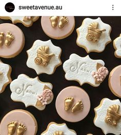 baby shower cookies decorated with gold and pink icing