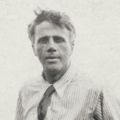 an old black and white photo of a man wearing a tie