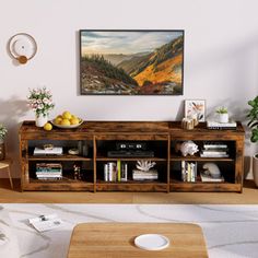 a living room scene with focus on the coffee table and bookshelf in the foreground