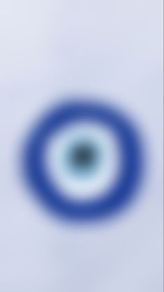 an abstract blue and white background with a circular design in the center that appears to be blurry