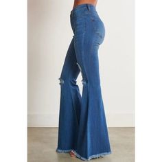 A pair of exaggerated, high-rise flare jeans featuring a front whiskered wash, open distressed knee detail, classic 5-pocket construction, frayed raw hem, and a zip-fly closure. -Rise: 11" Inseam: 33" -Model is 5'8" and wearing a size 3 -True to size Distressed Cutoff Flare Jeans For Fall, High Waist Frayed Hem Flares For Fall, High Waist Flares With Frayed Hem For Fall, Trendy Dark Wash Cutoff Flare Jeans, Trendy Cotton Flares With Frayed Hem, Fitted High Rise Distressed Flares, Ripped Cutoff Flare Jeans For Fall, Denim Blue Cutoff Flare Jeans For Fall, Distressed High-rise Fitted Flares