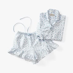 These airy and lightweight pajamas are perfect for wearing all year round. The ruffled trim and botanical motif are colorful and charming, while breathable cotton sateen keeps you feeling comfy during sleep. Designed exclusively for Pottery Barn Teen by lifestyle brand LoveShackFancy. KEY PRODUCT POINTS By choosing our cotton products, you're supporting our investment in Better Cotton's mission. This product is sourced via mass balance and therefore may not contain Better Cotton. Learn more at b Coastal Pajama Set, Light Blue Pajama Set, Aesthetic Pajamas, Luxury Pajamas, Textile Manufacturing, Cute Pjs, Cute Pajama Sets, Floral Pajamas, Short Pj Set