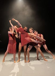 a group of people standing on top of a stage