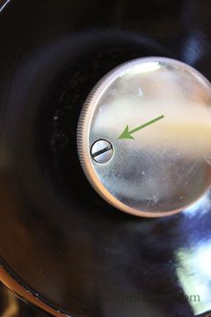 a close up view of an air fryer with the clock on it's side