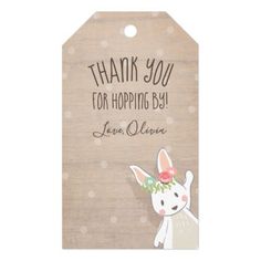 a wooden tag that says thank you for hopping by with an image of a bunny wearing a flower in its hair