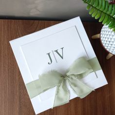 a white box with a green bow on it