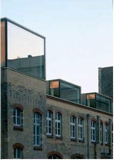 an old brick building with some windows on top