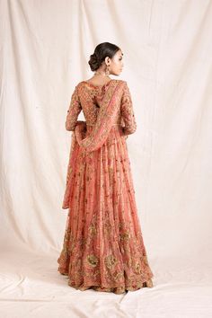 Embroidered Peach Lehenga Pakistani Mehndi Dresses are a breathtaking choice to wear on your big day. Peach Lehenga and embroidered choli create a magnificent masterpiece for the Bride. Lehenga Choli comes in premium quality fabric as always which will never disappoint you and it wins everyone's hearts at very first glance. Front Open Pishwas Gown: Designer Embroidered Peach Lehenga Pishwas embellished dress is beautifully adorned with embroidery, stones, zardozi, and dabka work. The choli has a Embroidery Stones, Bride Lehenga, Pakistani Mehndi Dress, Lehenga Pakistani, Peach Lehenga, Dabka Work, Pakistani Mehndi, Heavy Dupatta, Mehndi Dresses