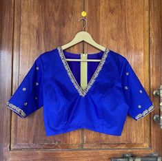 Blue With Yellow Blouse Designs, V Neck Work Blouse Designs, Blue Embroidered Unstitched Top For Wedding, Blue Tops With Dori Work For Wedding, Fitted Blouse With Dabka Work For Diwali, Blue Dola Silk Blouse With Zari Work, Blue Dola Silk Blouse With Resham Embroidery, Blue Art Silk Blouse With Dori Work, Blue Resham Embroidered Dola Silk Blouse