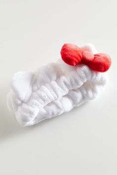 a pair of white socks with red hearts on them sitting on top of each other