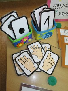 a table topped with lots of cards and magnets