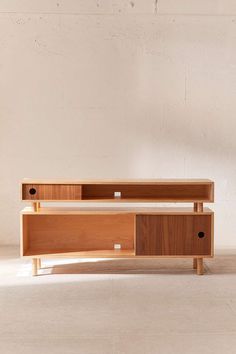 the sideboard is made out of wood and has two drawers on each side, one with