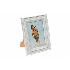 a white frame with an image of two people holding each other on the front and side