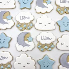 decorated cookies with stars, moon and clouds are displayed on a white tablecloth that says i am