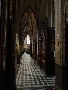 the inside of a church with checkered flooring