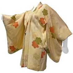 A wonderful vintage Japanese silk print kimono in a heavy cream silk with olive and rust floral pattern throughout . Traditional kimono-cut style with dramatic sleeves and front tie closure. Wonderful condition and great for lounging at home with friends! Fits up to a size large. Silk Kimono Dress, Cute Kimonos, Dramatic Sleeves, Floral Print Kimono, Kimono Vintage, Traditional Kimono, Warm Colour Palette, Kimono Pattern, Color Crema