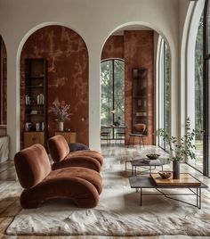 an elegant living room with large arched windows