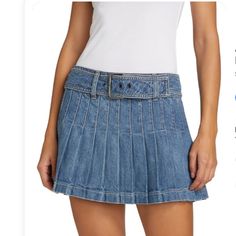 Alice + Olivia Mera Denim Pleated Mini Skirt With Buckle Alice + Olivia "Mera" Denim Pleated Skirt With An Adjustable Buckle. Size Info True To Size. 24=00, 25=0, 26=2, 27=4, 28=6, 29=8, 30=10, 31=12, 32=14. Low Waist Mini Length Fit And Flare Silhouette Back Zip Polyester/Acrylic Dry Clean Imported Fitted Mid-rise Denim Skirt With Belt Loops, Fitted Denim Skort With Belt Loops, Fitted Pleated Medium Wash Bottoms, Fitted Medium Wash Pleated Bottoms, Spring Mid-rise Skirt With Belt Loops, Fitted Denim Belted Bottoms, Fitted Medium Wash Mini Skirt With Belt Loops, Spring Fitted Belted Denim Skirt, Fitted Belted Denim Skirt For Spring