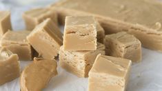 several pieces of peanut butter fudge on wax paper