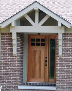 a wooden door on the side of a brick building